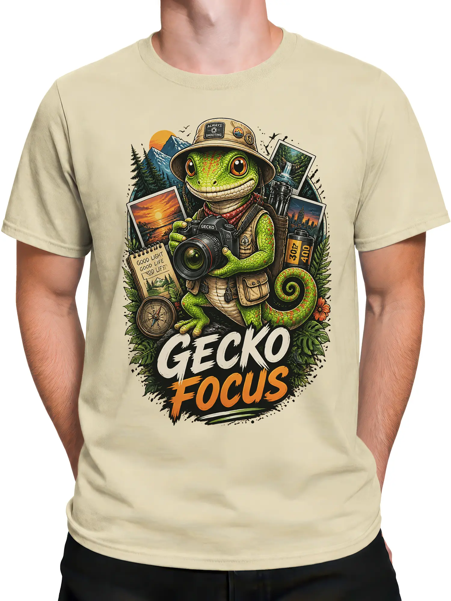 Male torso wearing a beige gecko photographer T-shirt with colorful outdoor adventure artwork
