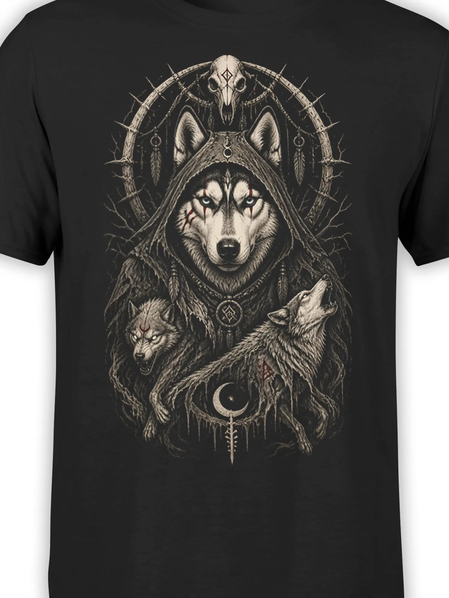 Close-up of hooded wolf artwork with bone tones, red accents, feathers, and symbols on a black T-shirt