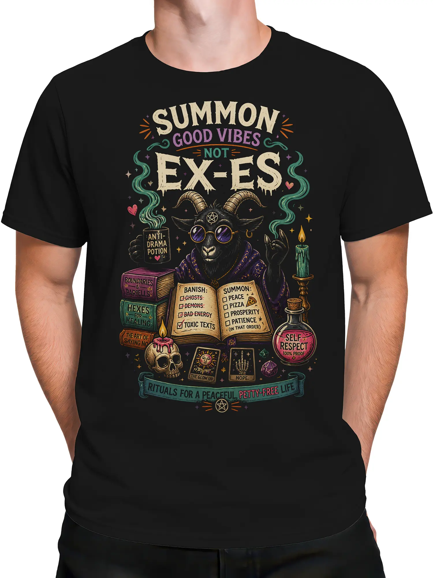 Male torso wearing a black T-shirt with horned goat artwork and a “Summon Good Vibes” message
