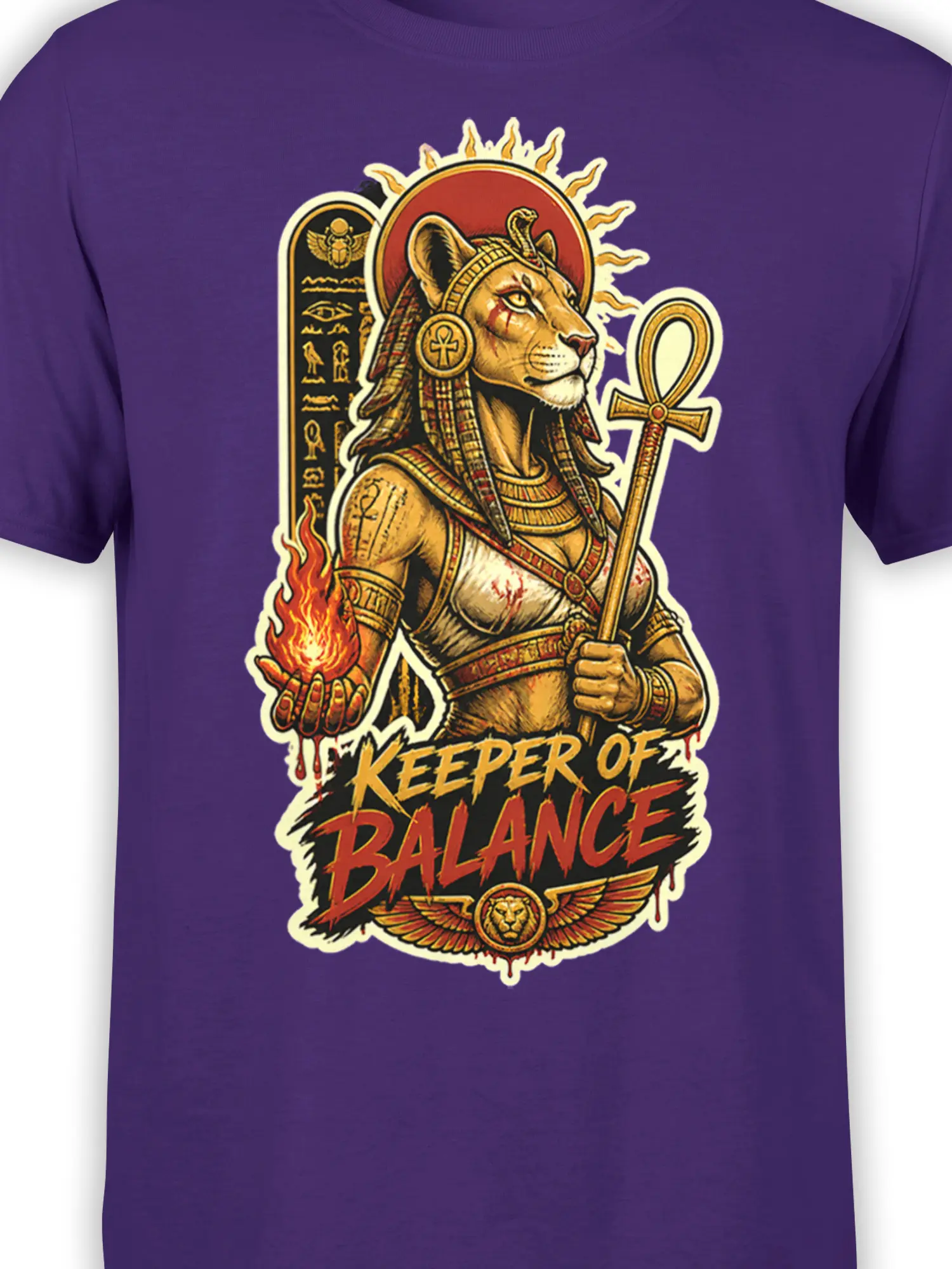 Close-up of feline warrior artwork with fire, ankh staff, and balance lettering on purple fabric