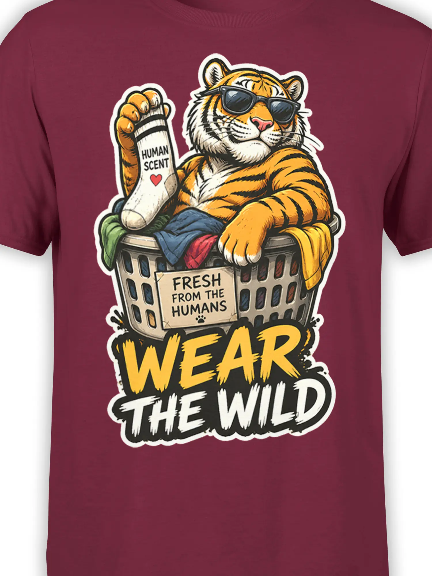 Close-up of the tiger in sunglasses, laundry basket, “Human Scent” sock, and bold text on a burgundy shirt
