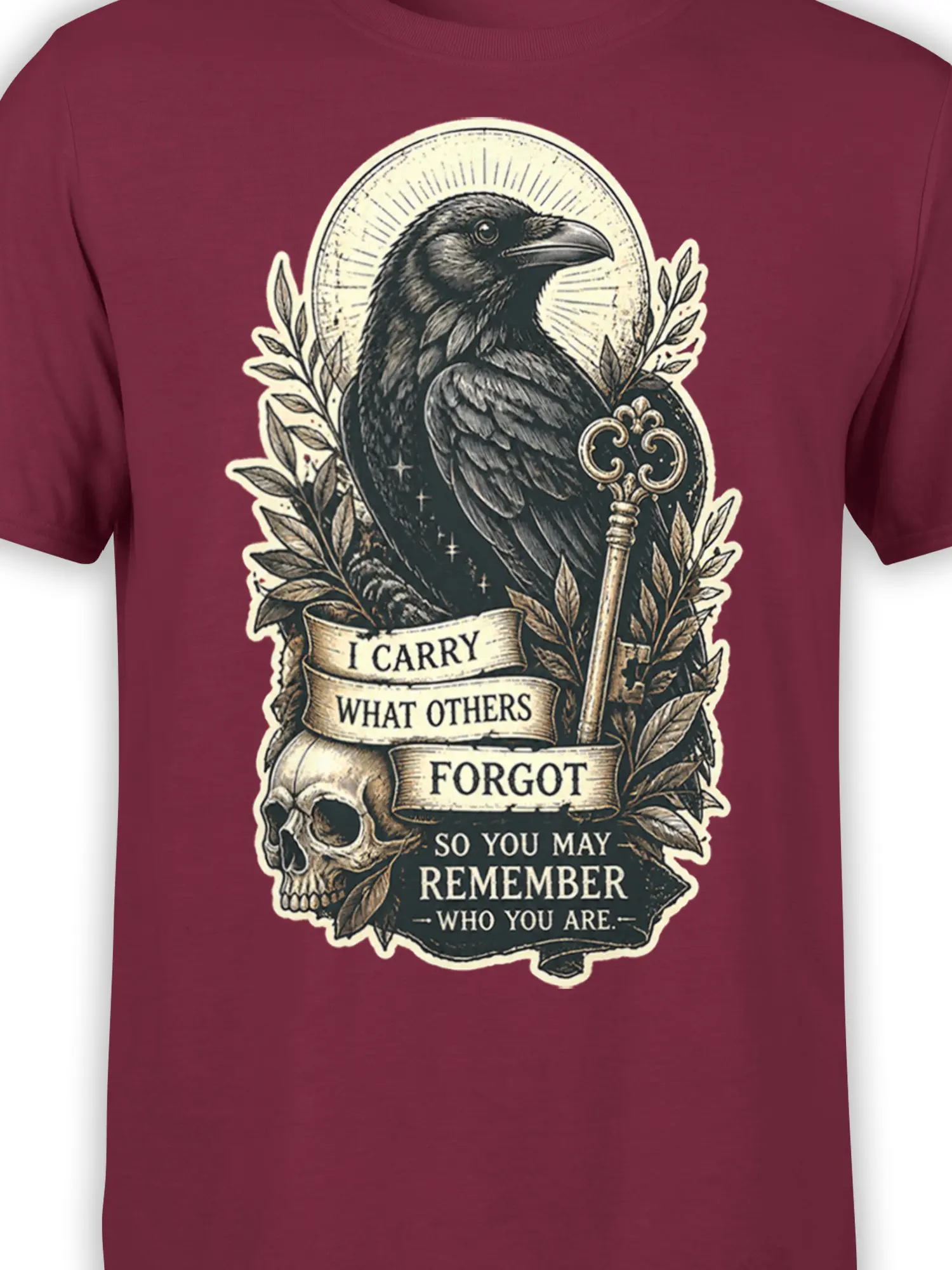 Close-up of burgundy shirt design featuring a raven, skull, ornate key, halo, and remembrance message