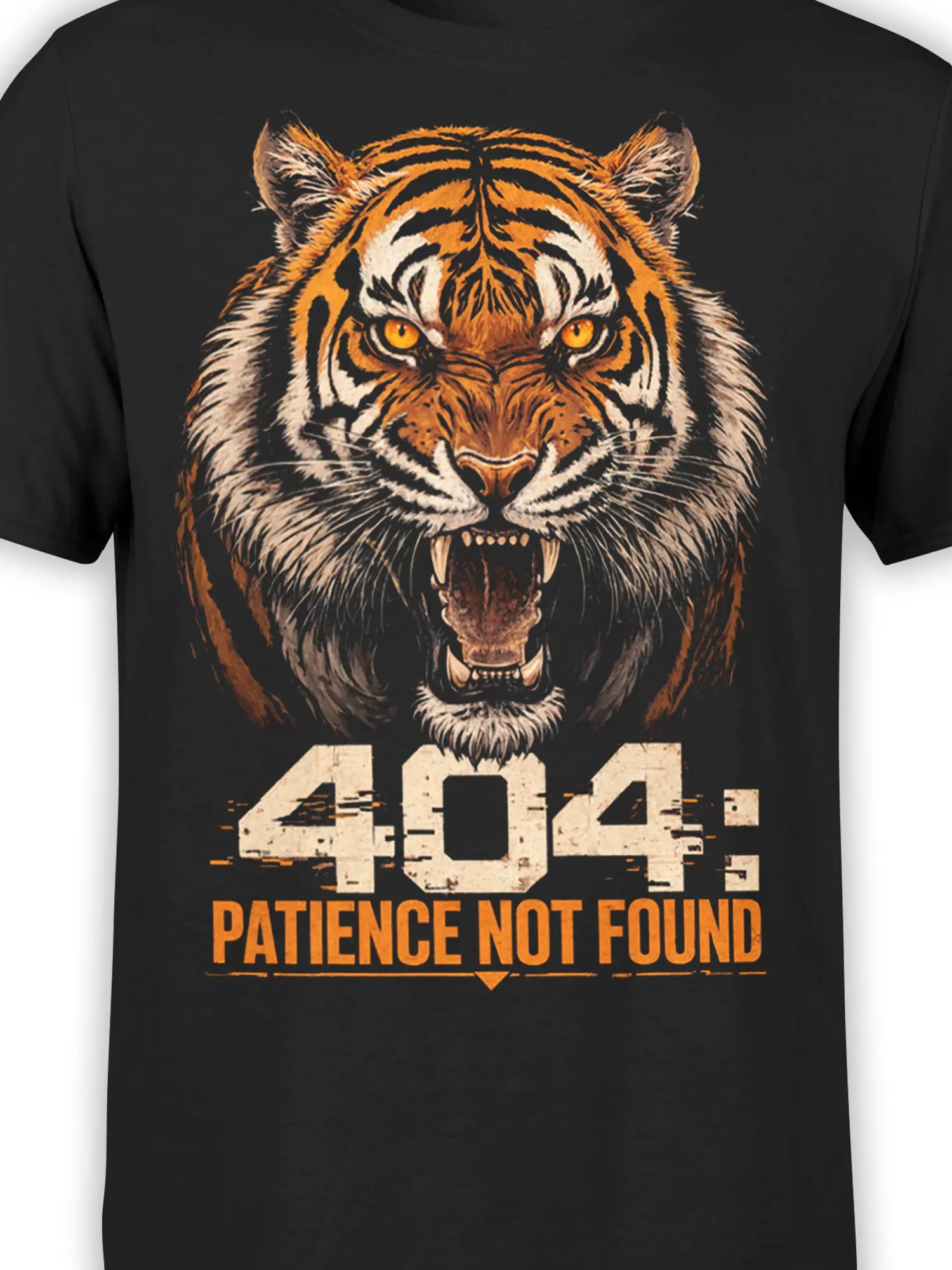 Close-up of orange tiger eyes and “404: Patience Not Found” artwork on a black T-shirt
