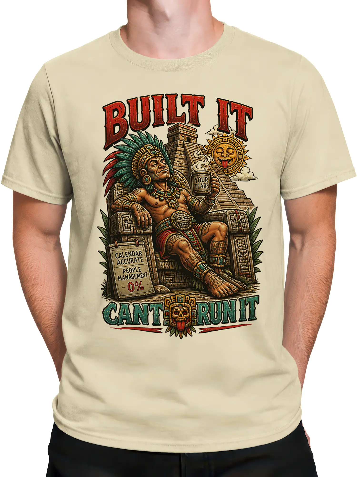 Male torso wearing beige T-shirt with ancient ruler temple artwork and boss humor text