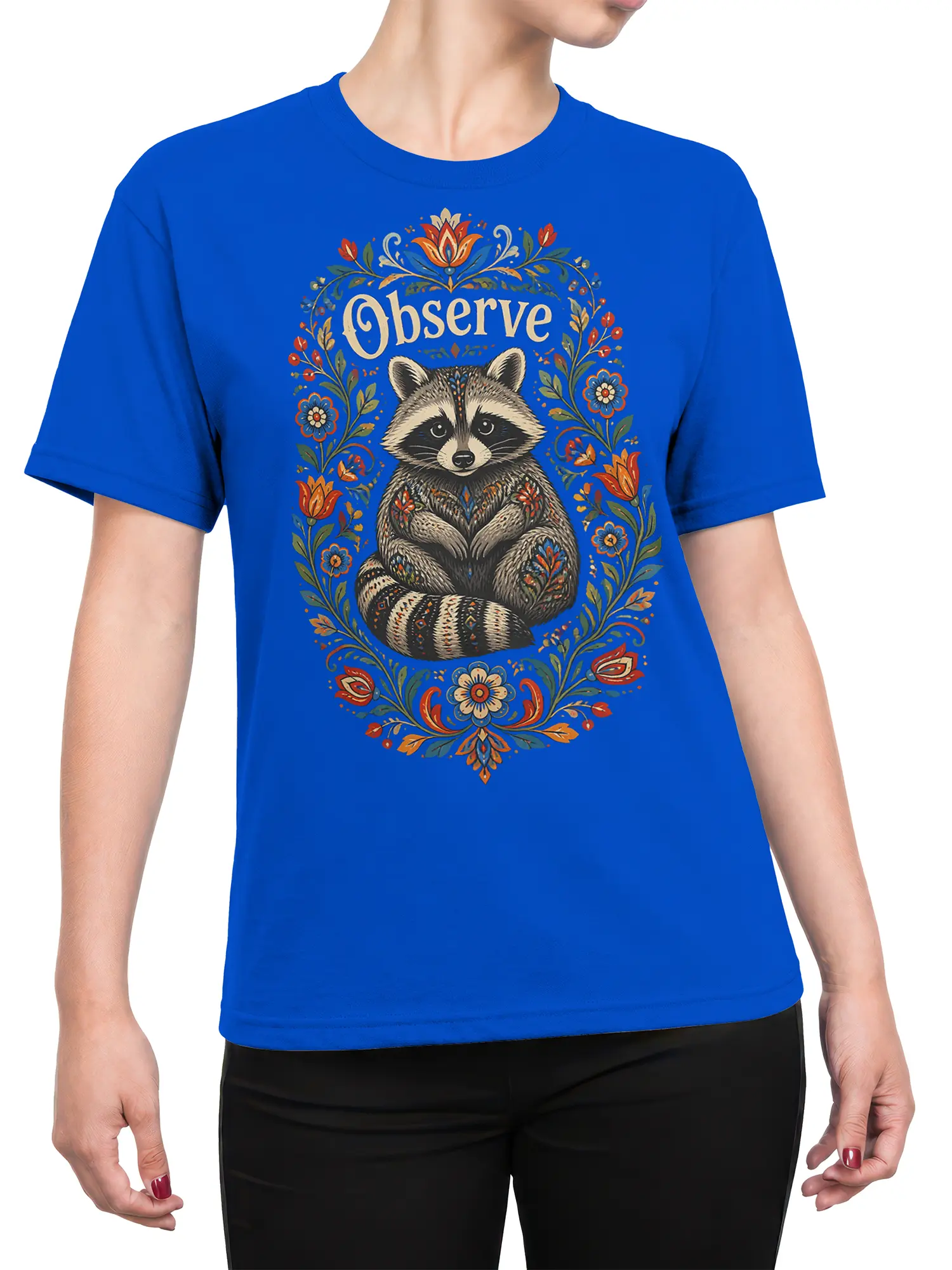 Female torso wearing a blue T-shirt with a floral raccoon and “Observe” graphic