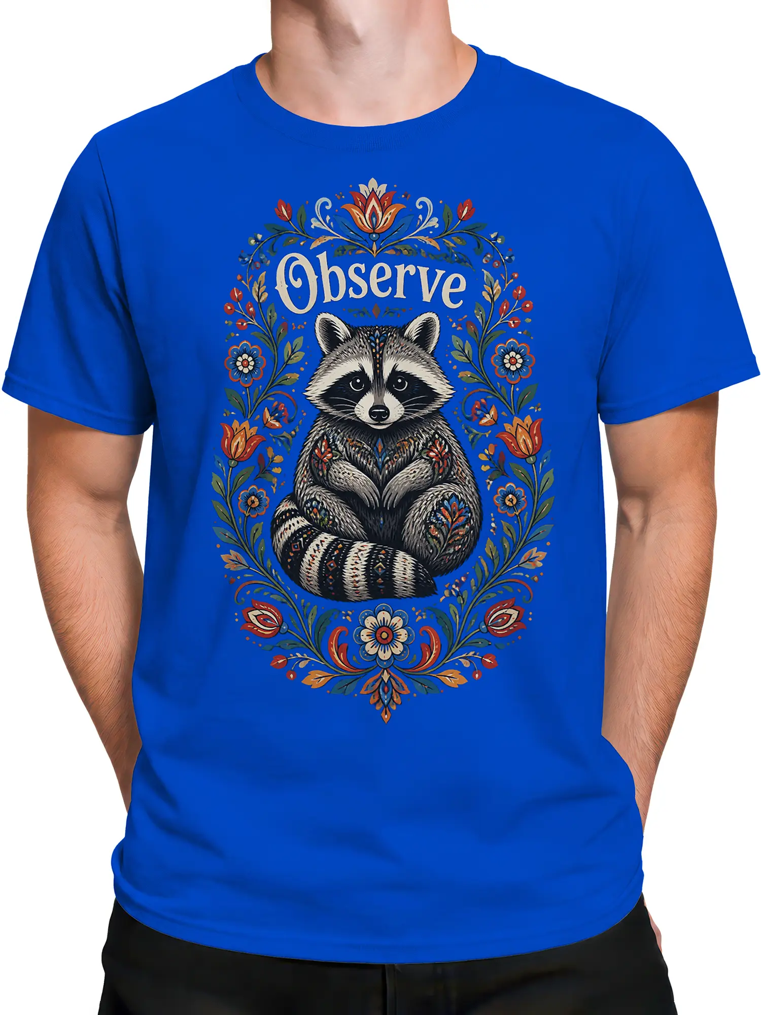 Male torso wearing a blue raccoon T-shirt with an ornate floral “Observe” graphic