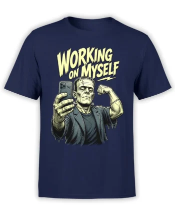 Stitched monster holding a smartphone and flexing on a navy T-shirt with yellow “WORKING ON MYSELF” text