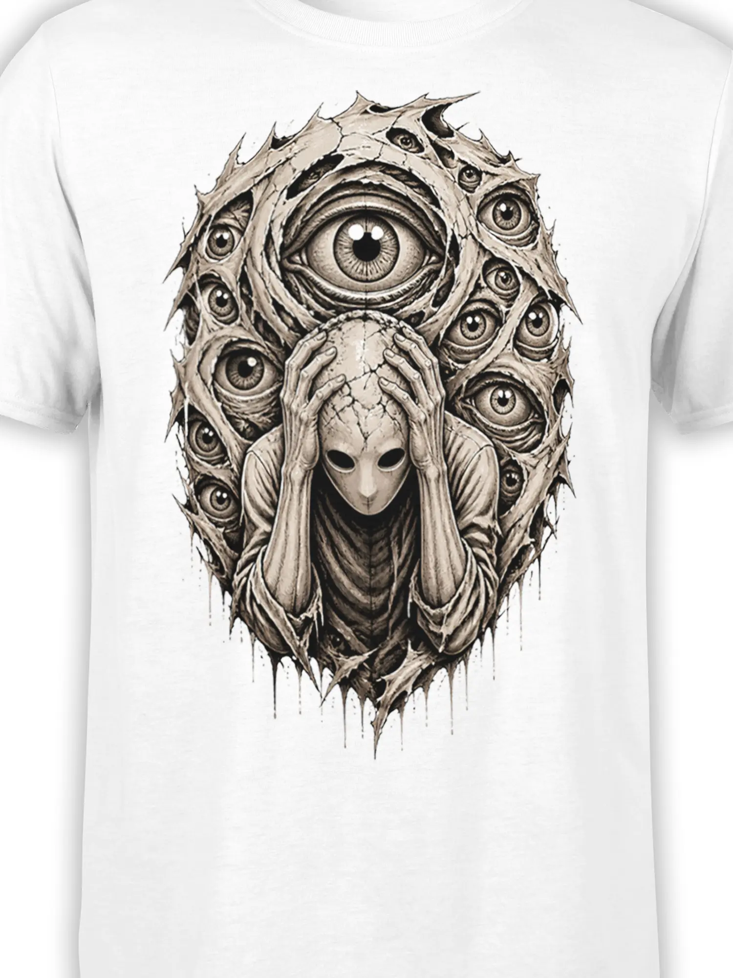 Close-up of the multi-eyed alien design on a white graphic tee with detailed sepia horror artwork