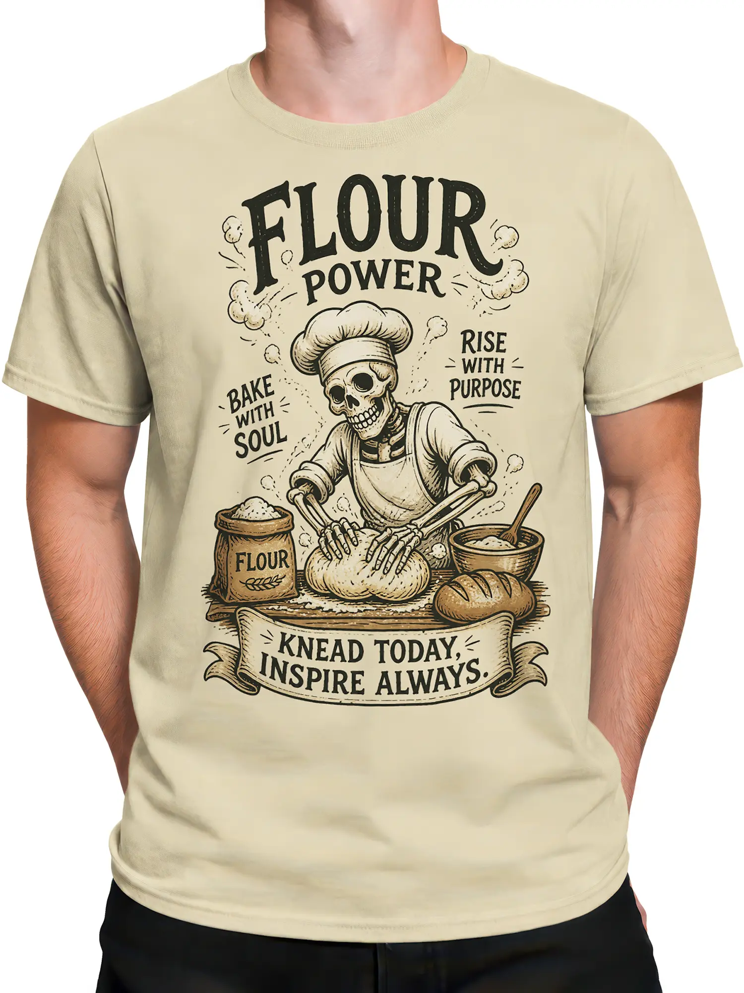 Male torso wearing a beige skeleton baker T-shirt with vintage flour and bread graphic