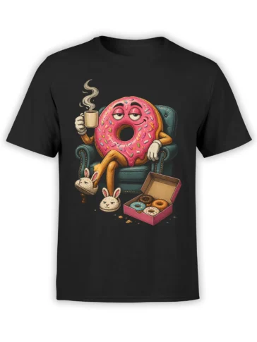 Black donut t-shirt with a sleepy pink frosted donut in an armchair, coffee cup, bunny slippers, and pastry box