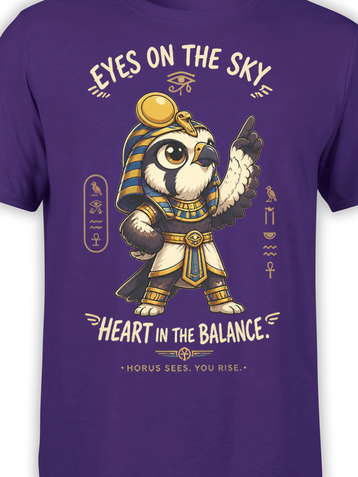 Close-up of purple Egyptian graphic tee showing the falcon deity, Eye of Horus, armor details, and ancient symbols