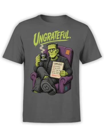 Gray graphic tee with a stitched green monster, complaint notebook, steaming mug, and “UNGRATEFUL” text