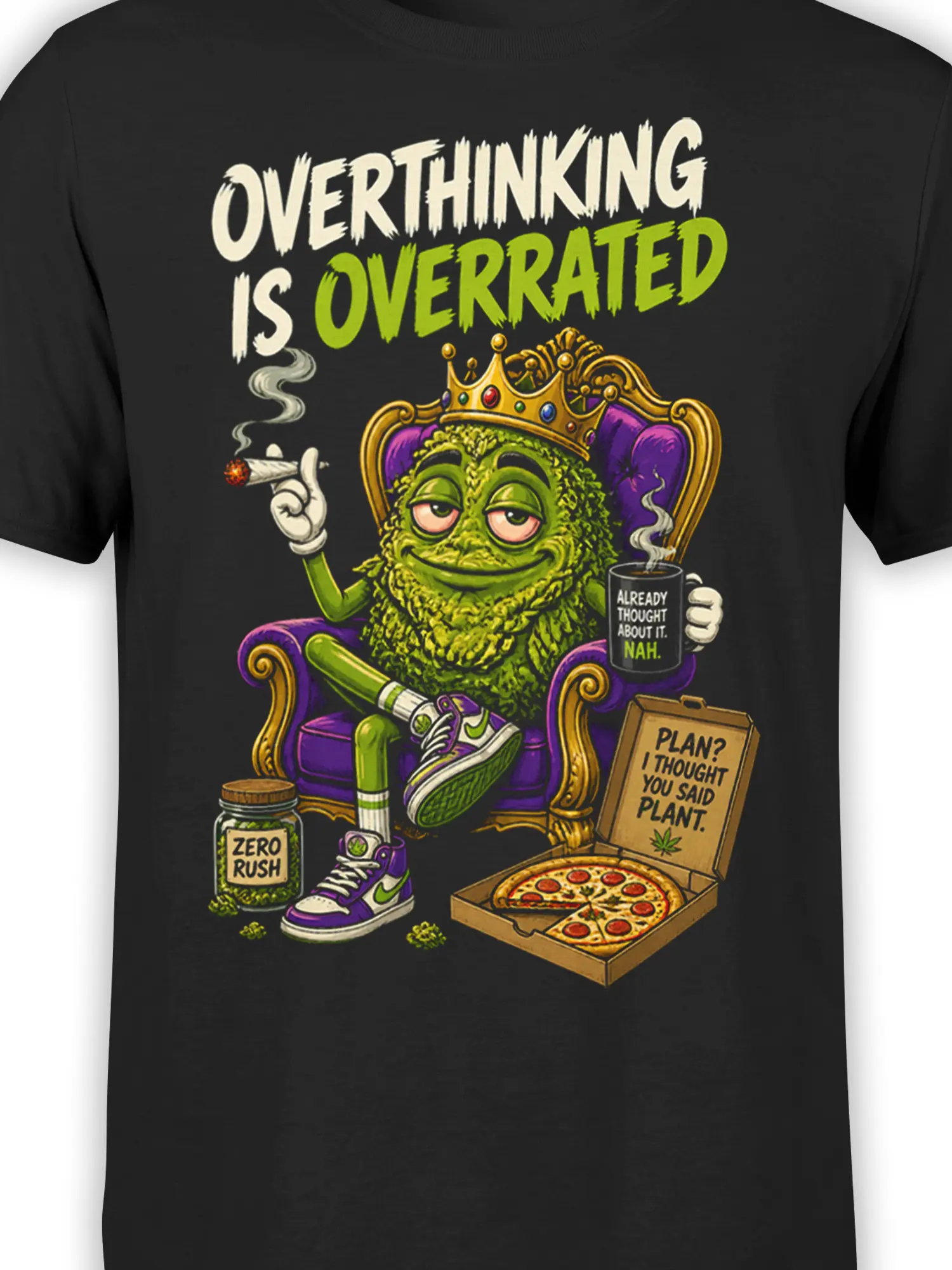 Close-up of crowned green monster artwork with sarcastic text and colorful pizza details on a black shirt