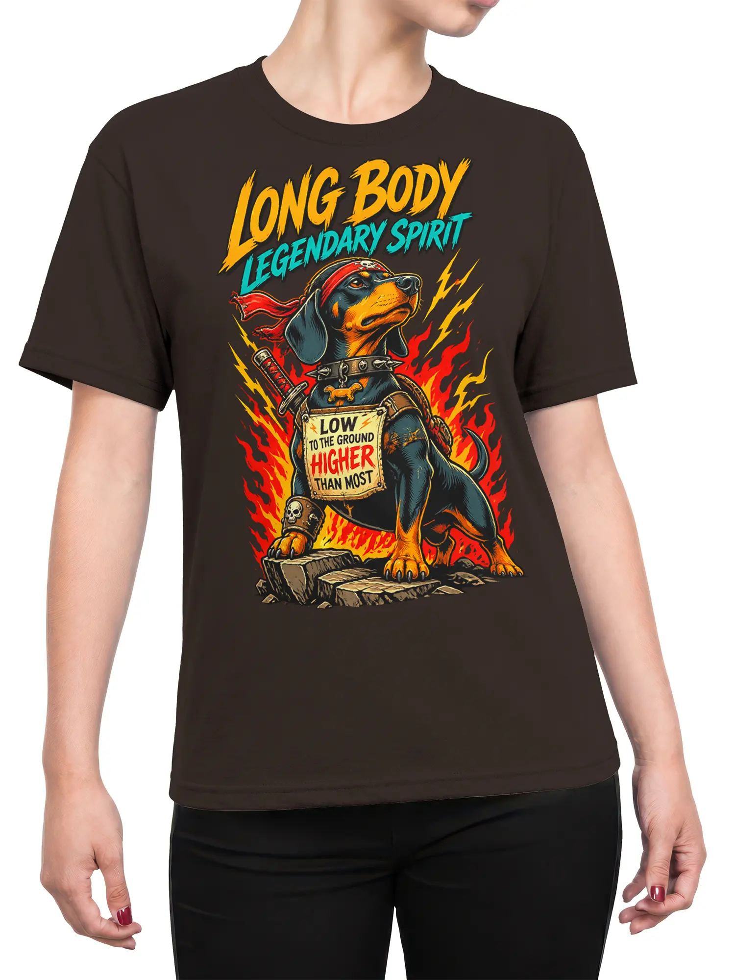 Female torso wearing a brown long-bodied dog warrior graphic T-shirt with flames, lightning, and bold retro lettering