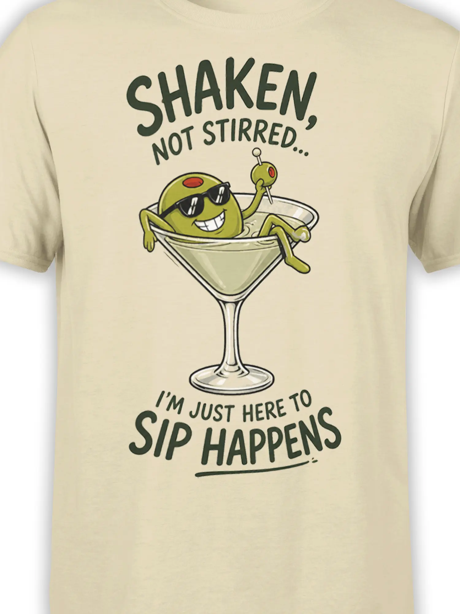 Close-up of the beige martini shirt design showing a sunglasses-wearing olive, cocktail glass, and “Sip Happens” lettering