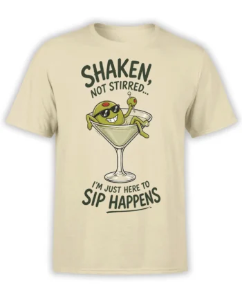 Beige martini graphic tee with a green olive in sunglasses and the text “Shaken, Not Stirred” and “Sip Happens”