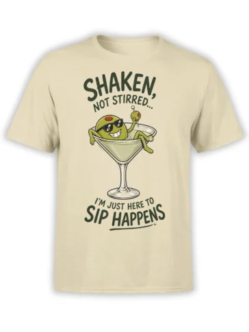Beige martini graphic tee with a green olive in sunglasses and the text “Shaken, Not Stirred” and “Sip Happens”