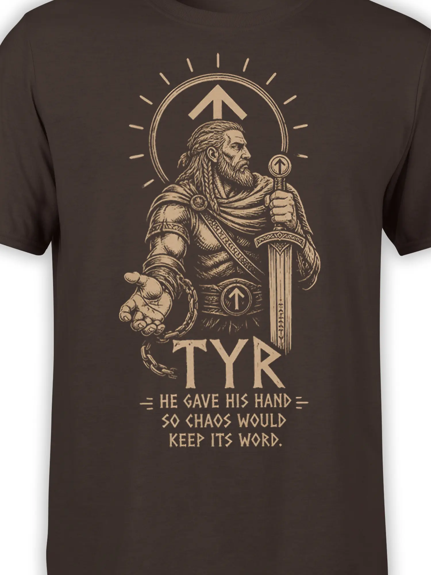 Close-up of Tyr warrior graphic with sword, shield, broken chain, and tan Norse symbols on a brown shirt