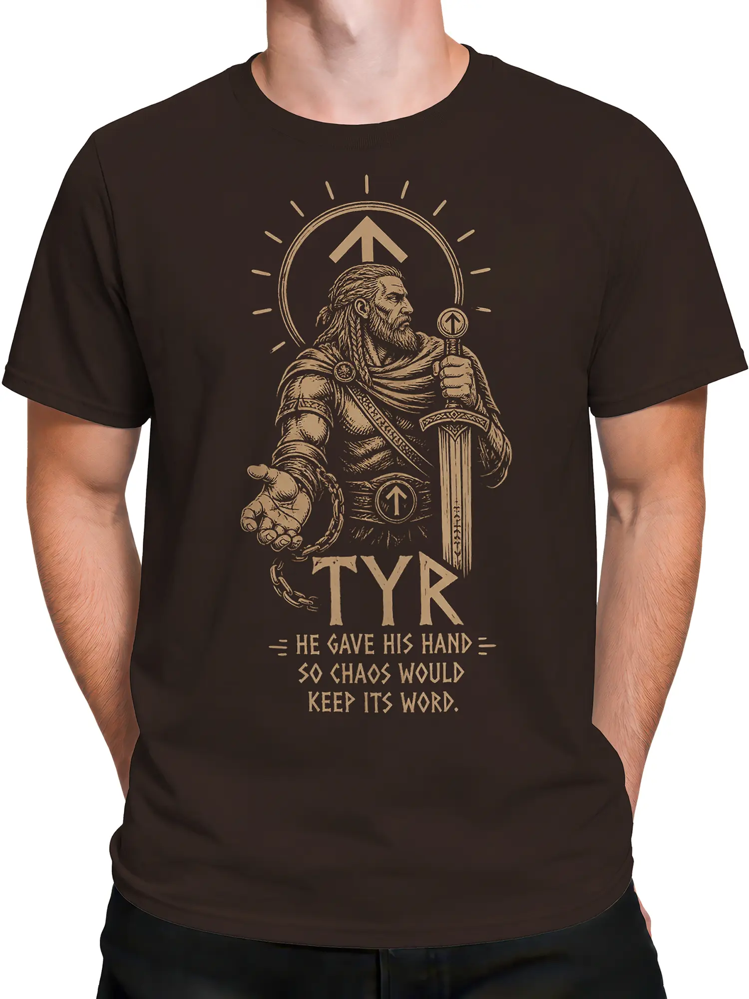 Male torso wearing a dark brown Tyr warrior graphic tee with sword, shield, broken chain, and Norse-inspired text