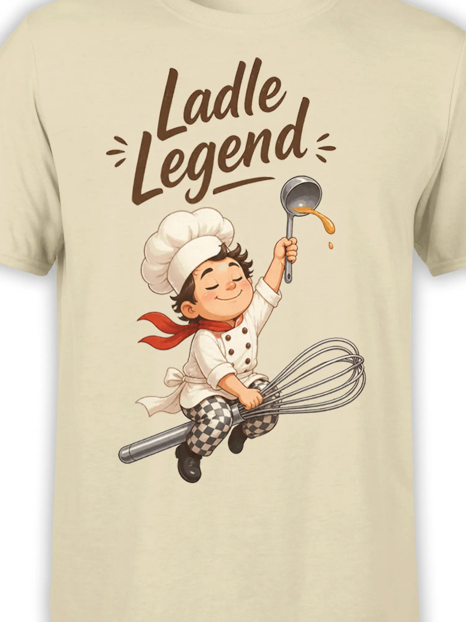 Close-up of Ladle Legend chef artwork with whisk and ladle on a beige T-shirt