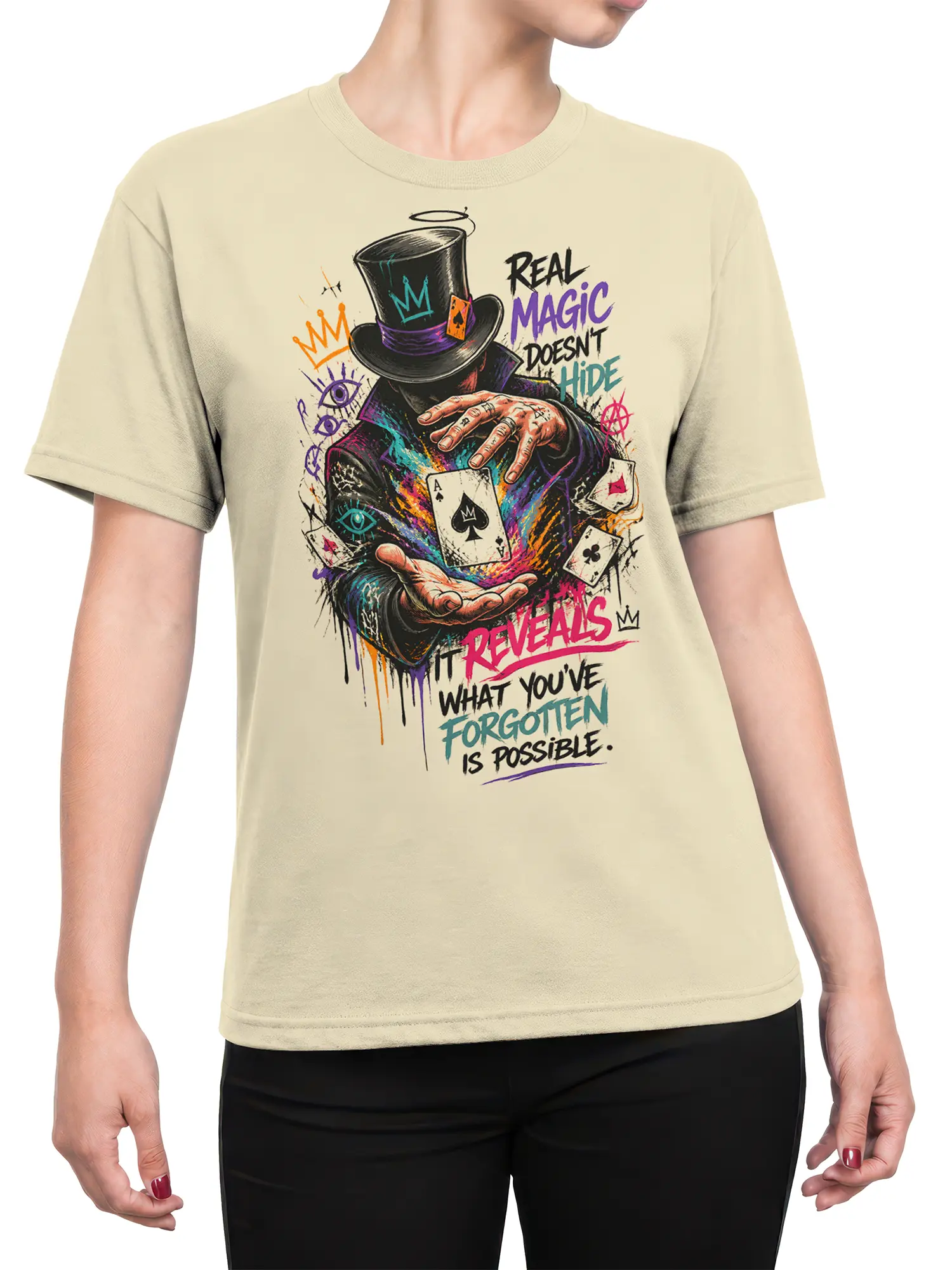Female torso wearing a beige magician T-shirt with colorful playing cards, top hat artwork, and mysterious lettering