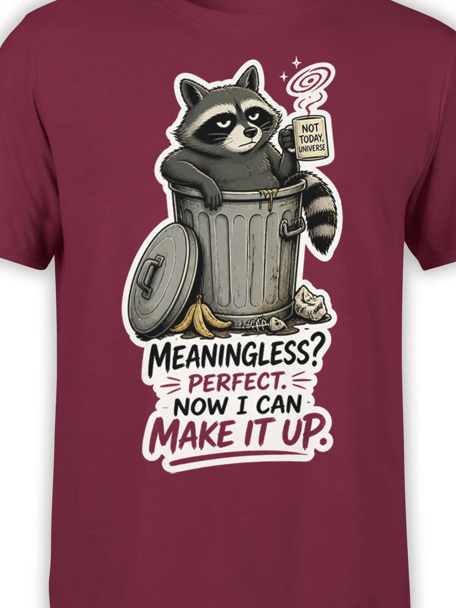 Close-up of a raccoon trash can graphic with coffee mug and cosmic lettering on burgundy fabric