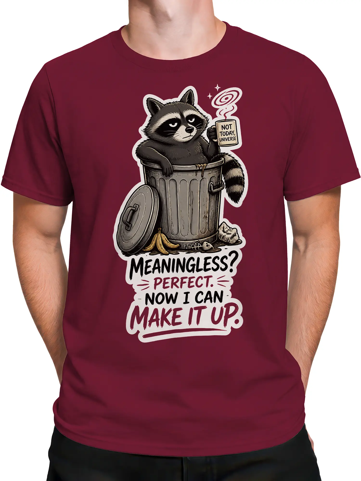 Male torso wearing a burgundy raccoon T-shirt with cosmic coffee humor and bold lettering