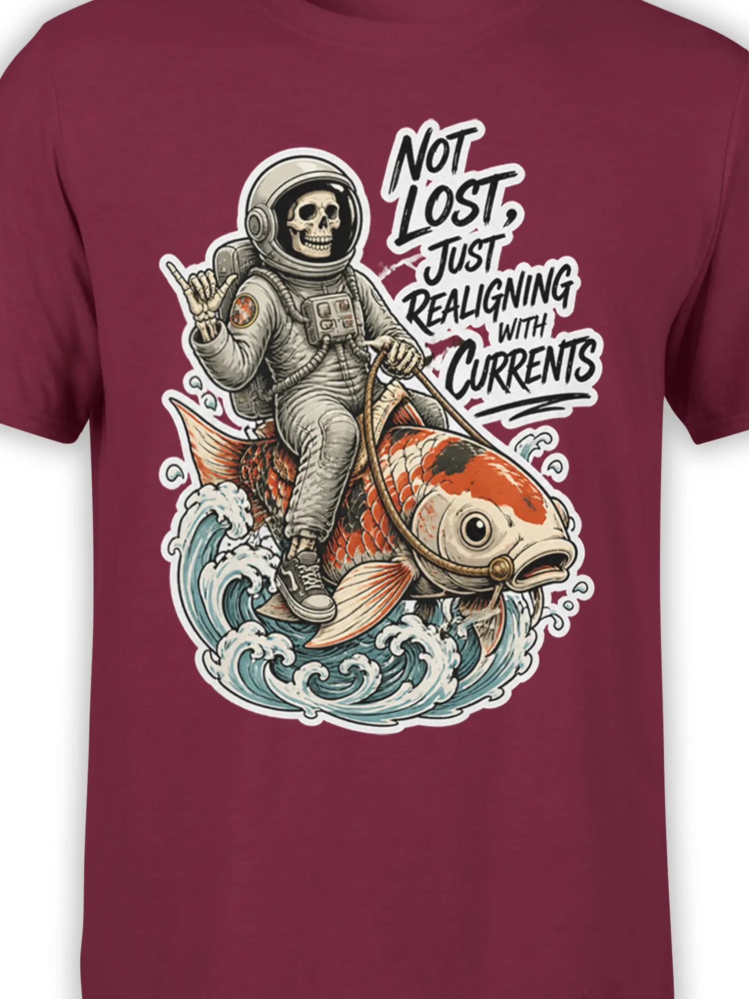 Close-up of the skull astronaut, koi fish, waves, and “Not Lost” lettering on a burgundy shirt