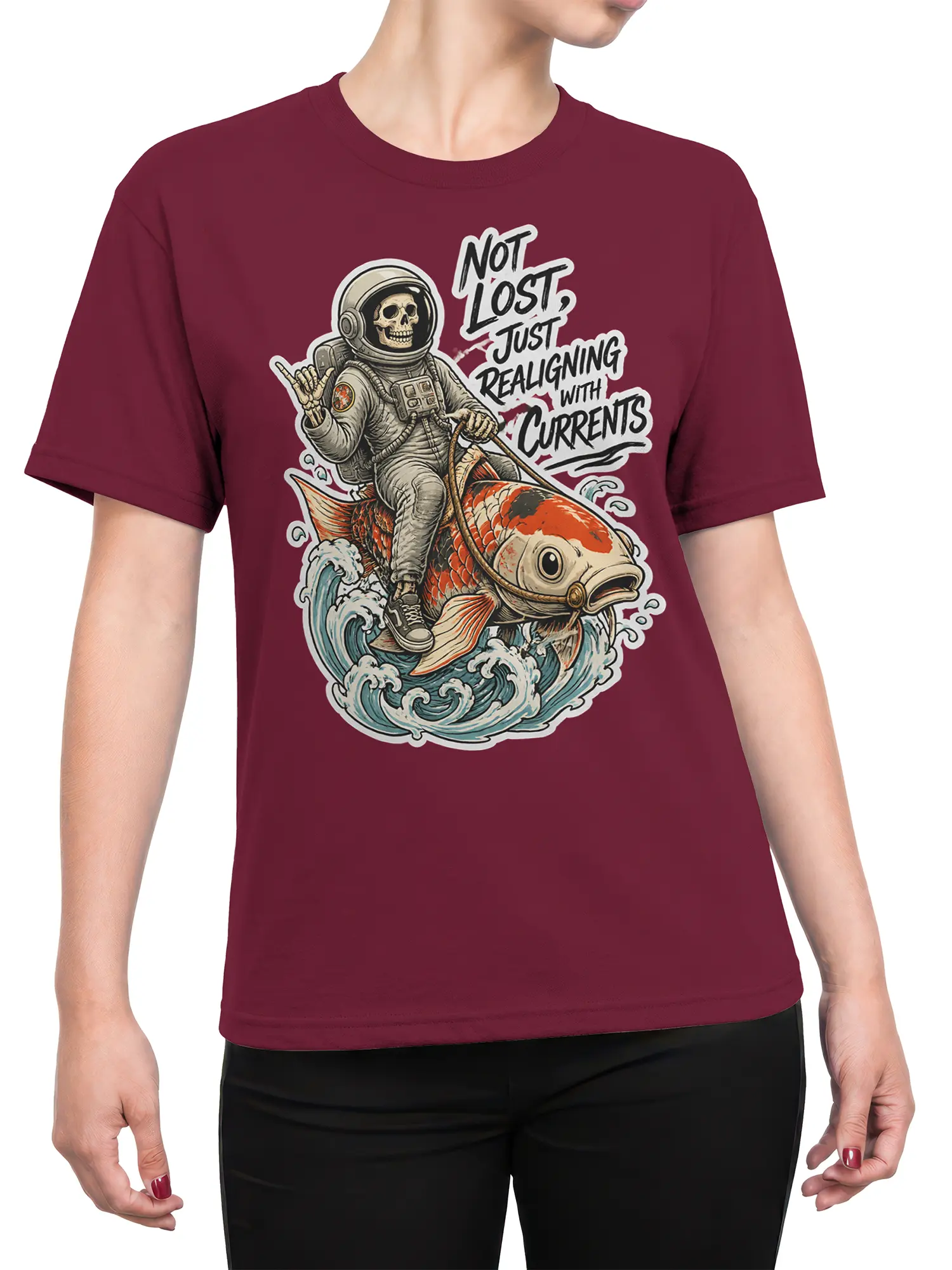 Female torso wearing a burgundy T-shirt with a skull astronaut riding a koi fish through waves