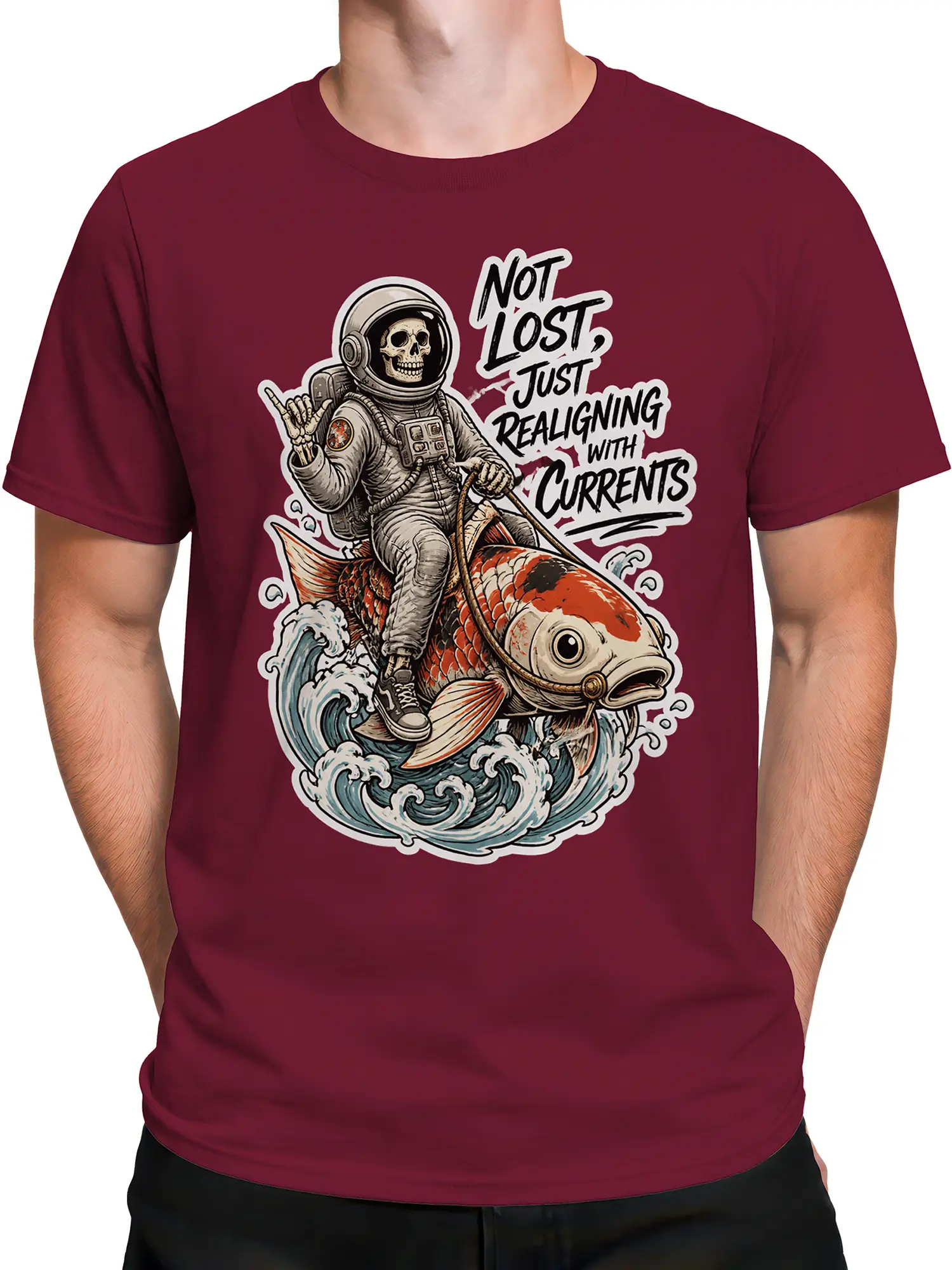Male torso wearing a burgundy graphic tee with a skull astronaut and koi fish wave design