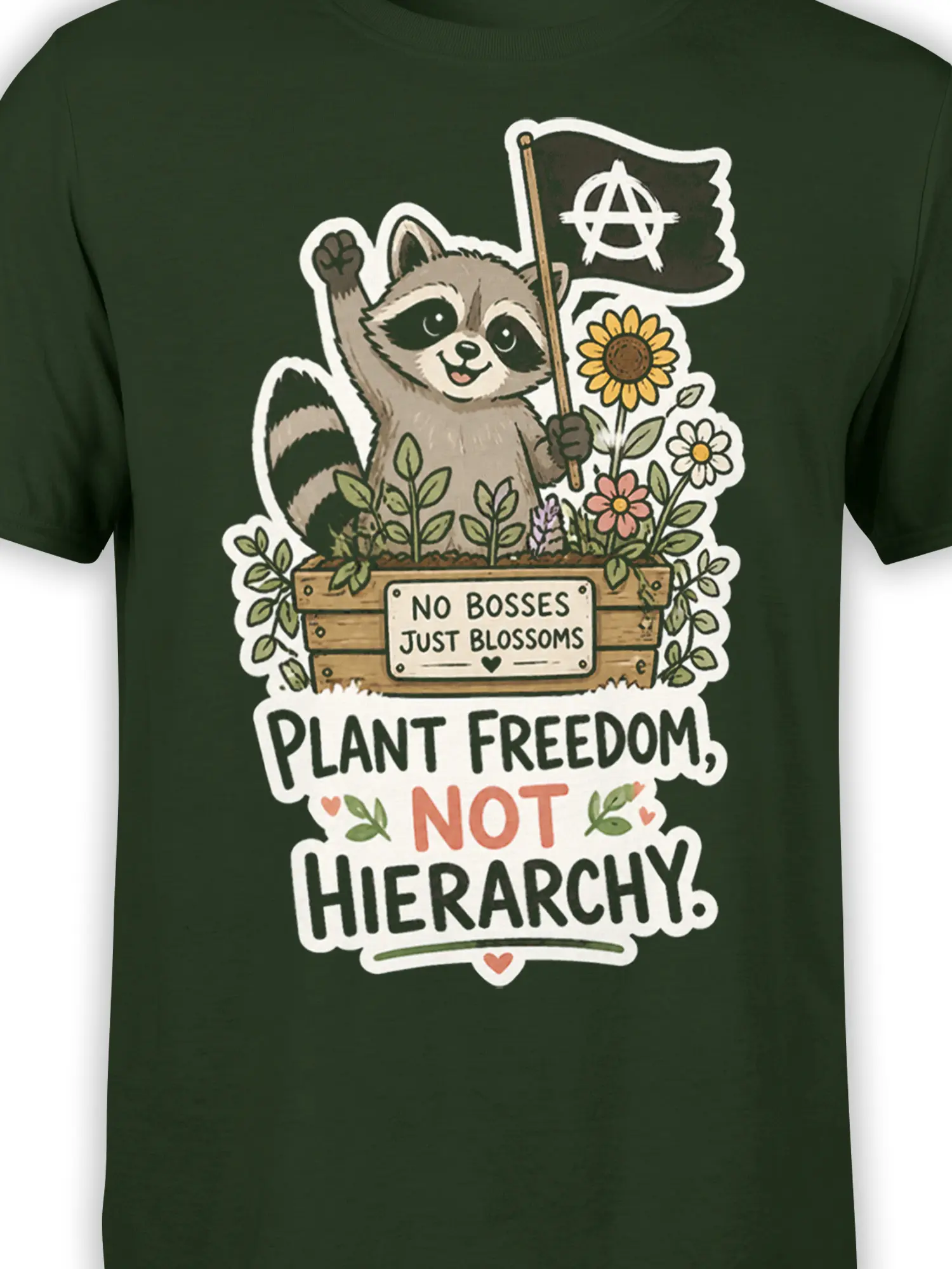 Close-up of raccoon, flowers, anarchy flag, and plant freedom lettering on a dark green shirt
