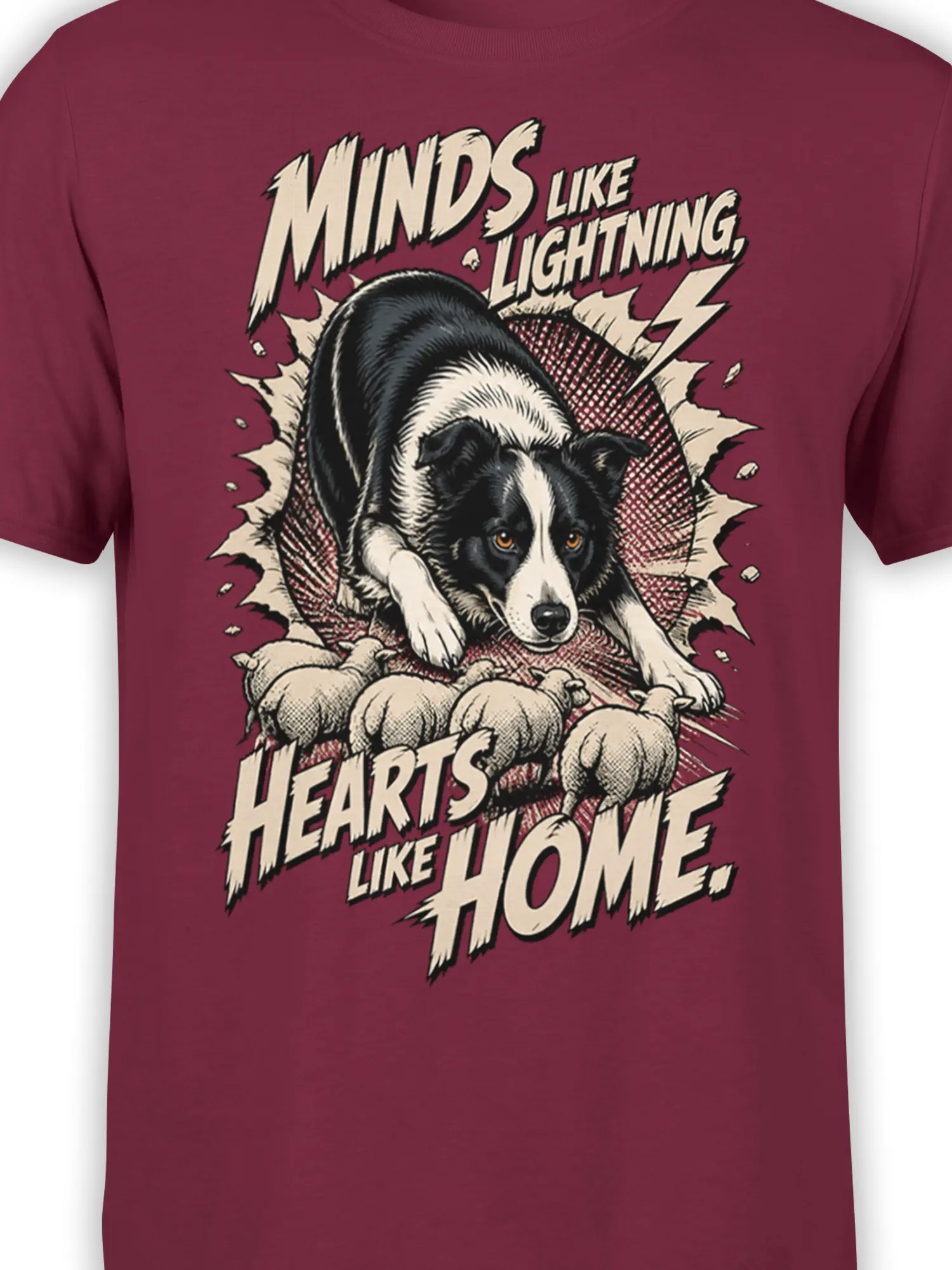 Close-up of black and white dog and puppy artwork with lightning bolts on a burgundy shirt