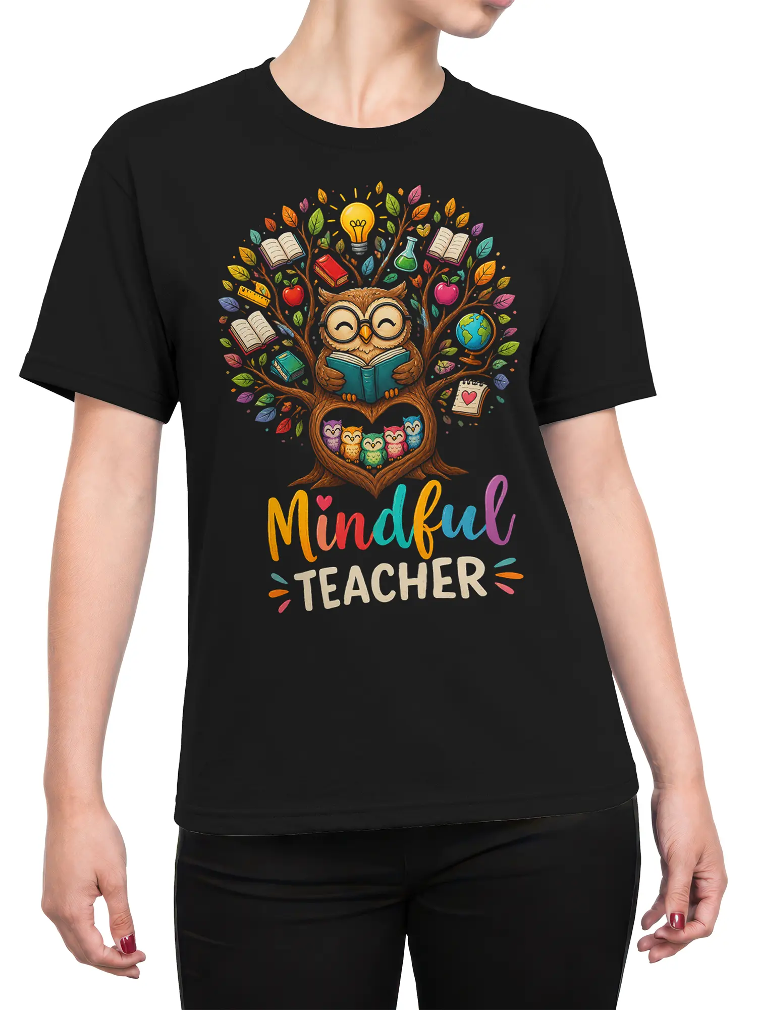 Female torso wearing a black shirt with colorful mindful owl teacher artwork and academic symbols