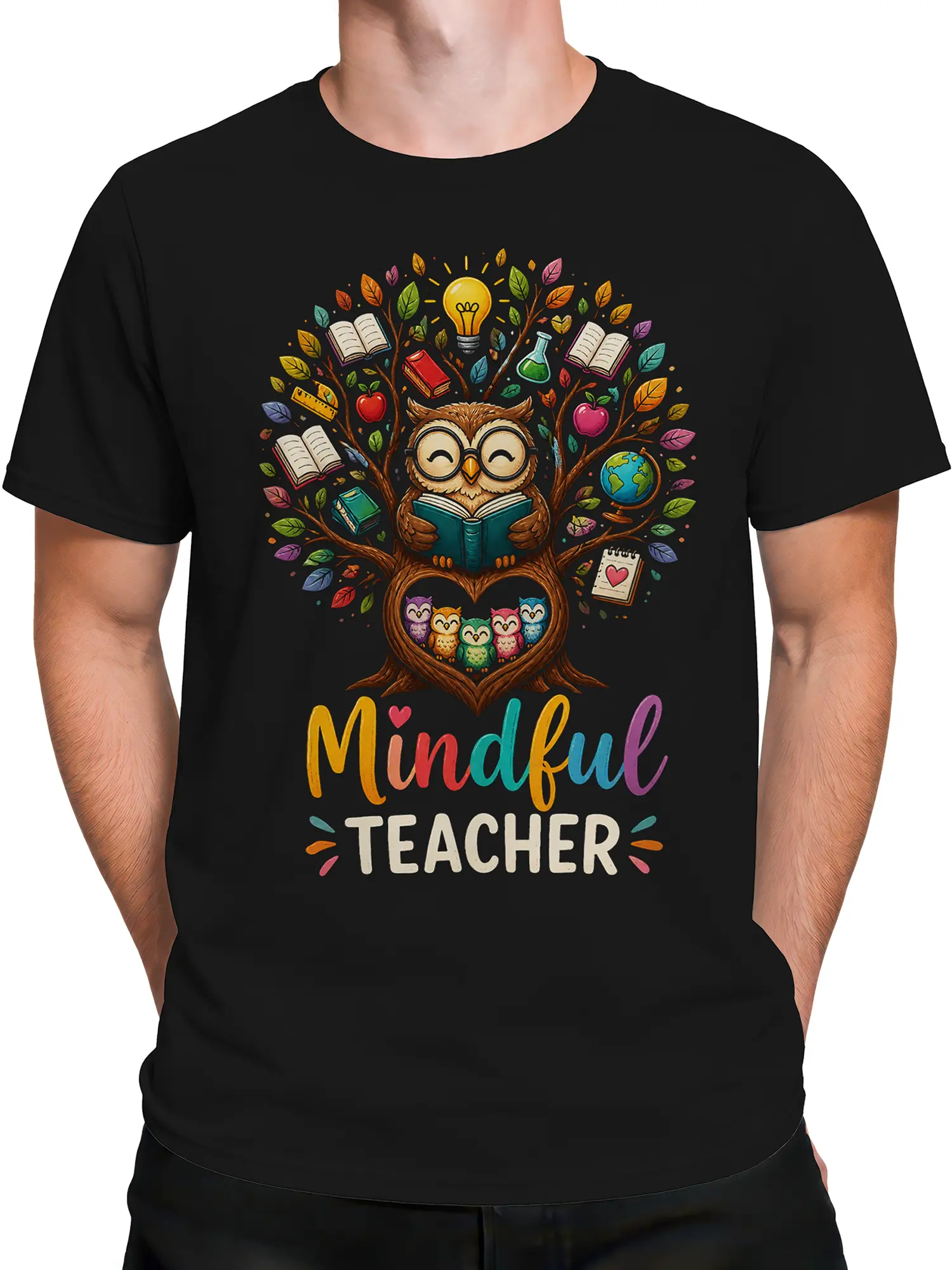 Male torso wearing a black mindful owl teacher shirt with colorful reading and school artwork