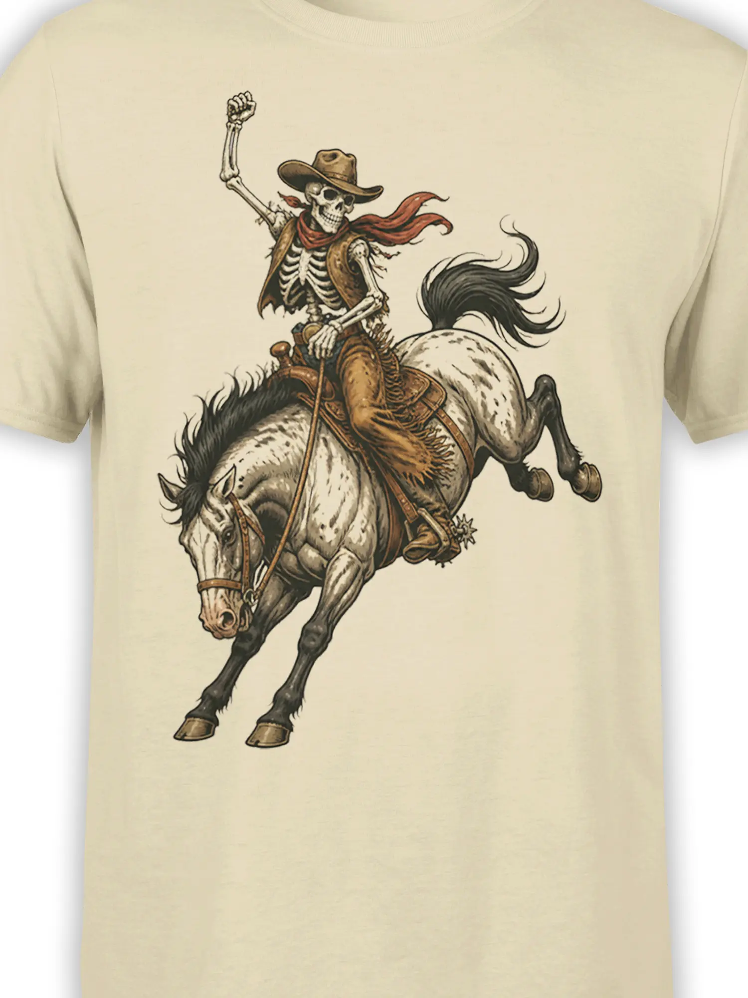 Close-up of skeleton cowboy and bucking horse artwork printed on a beige graphic T-shirt