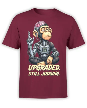 Cyborg monkey meditating on a burgundy shirt with “Upgraded. Still Judging.” graphic text