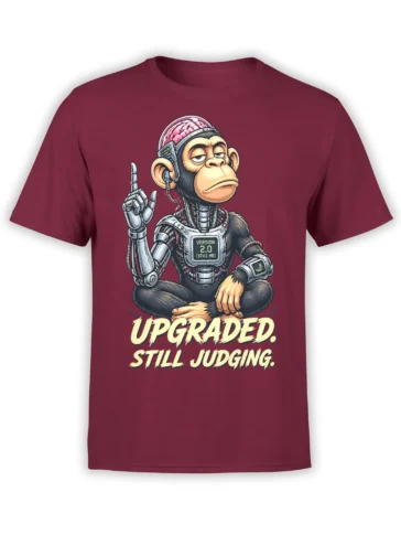 Cyborg monkey meditating on a burgundy shirt with “Upgraded. Still Judging.” graphic text