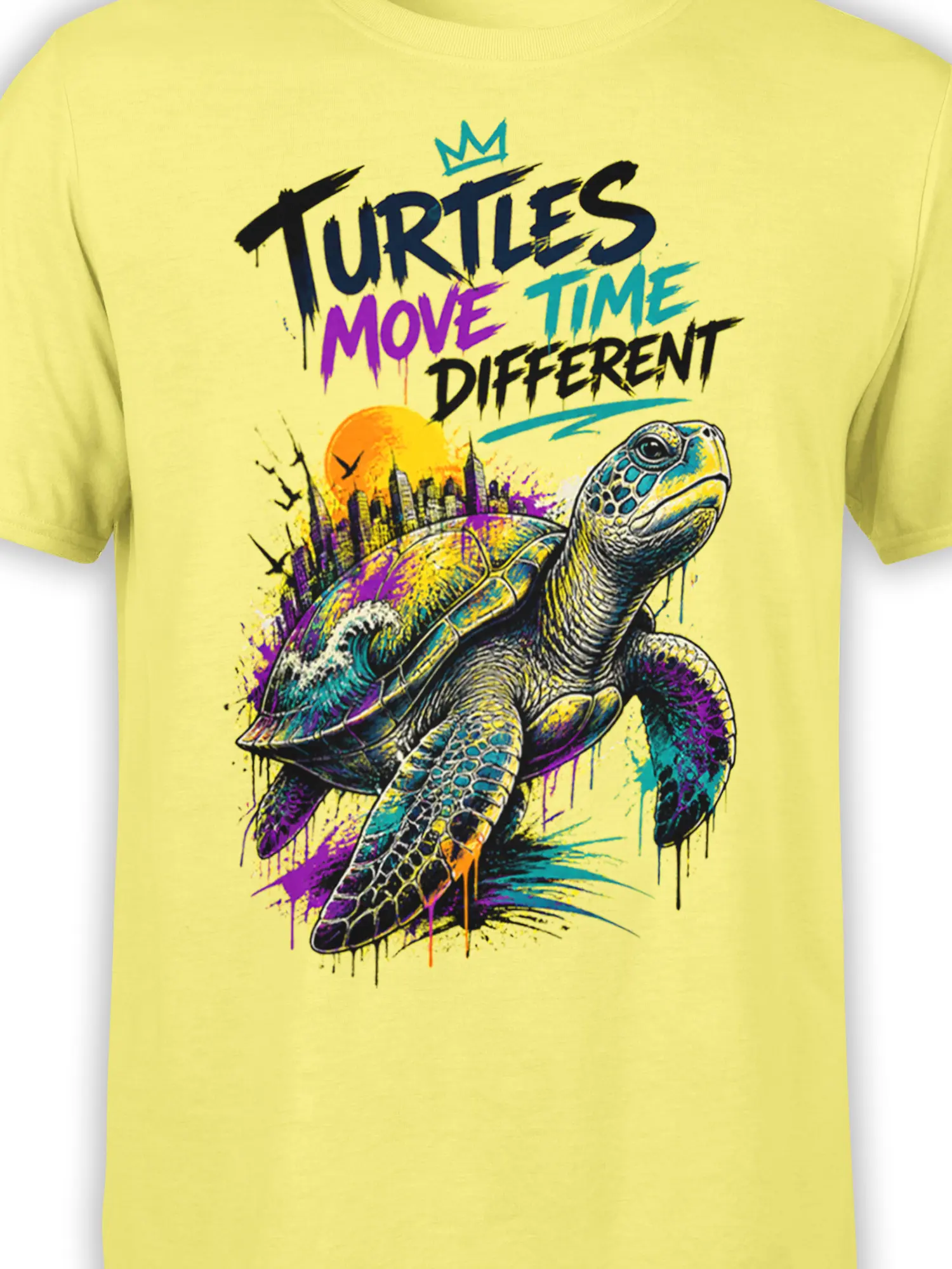 Close-up of colorful turtle artwork and city skyline with bold lettering on a yellow graphic tee