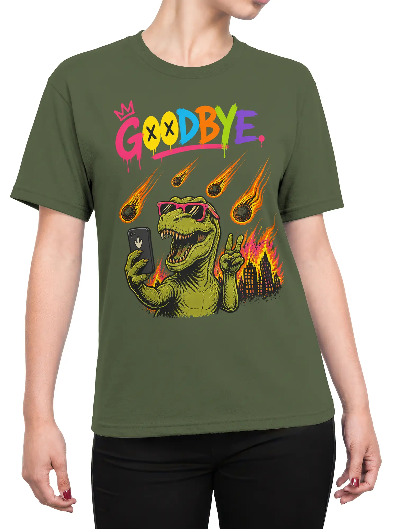 Female torso wearing a green dinosaur graphic tee with colorful GOODBYE lettering and a meteor-filled city scene