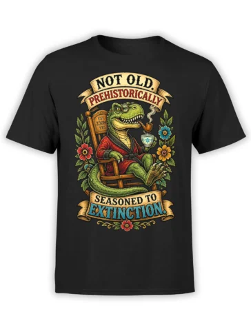 Black dinosaur T-shirt with a pipe-smoking prehistoric gentleman, red robe, tea cup, flowers, and extinction banners