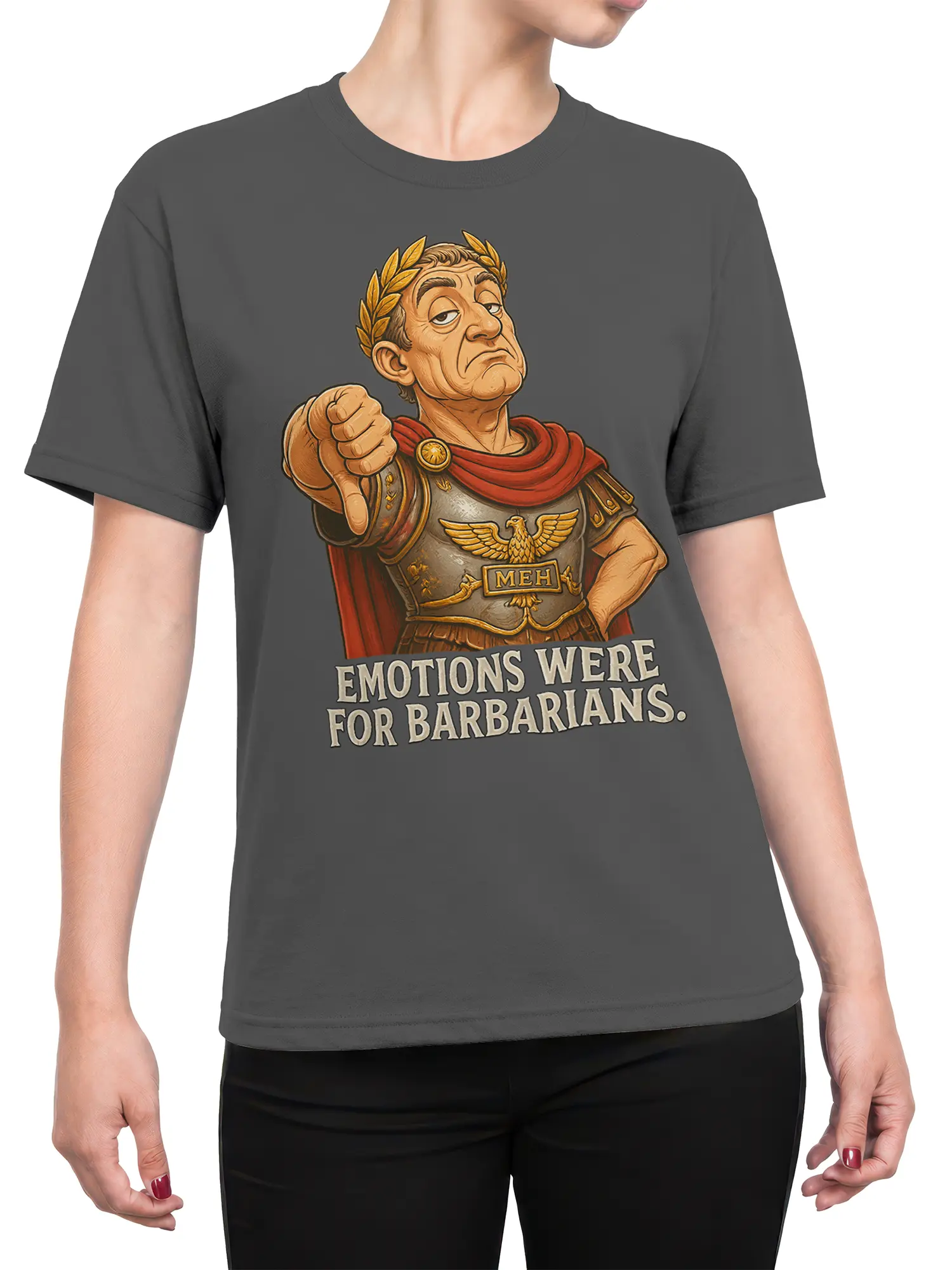 Female torso wearing a gray Roman warrior T-shirt with laurel crown, red cape, armor, and “Emotions Were for Barbarians” design