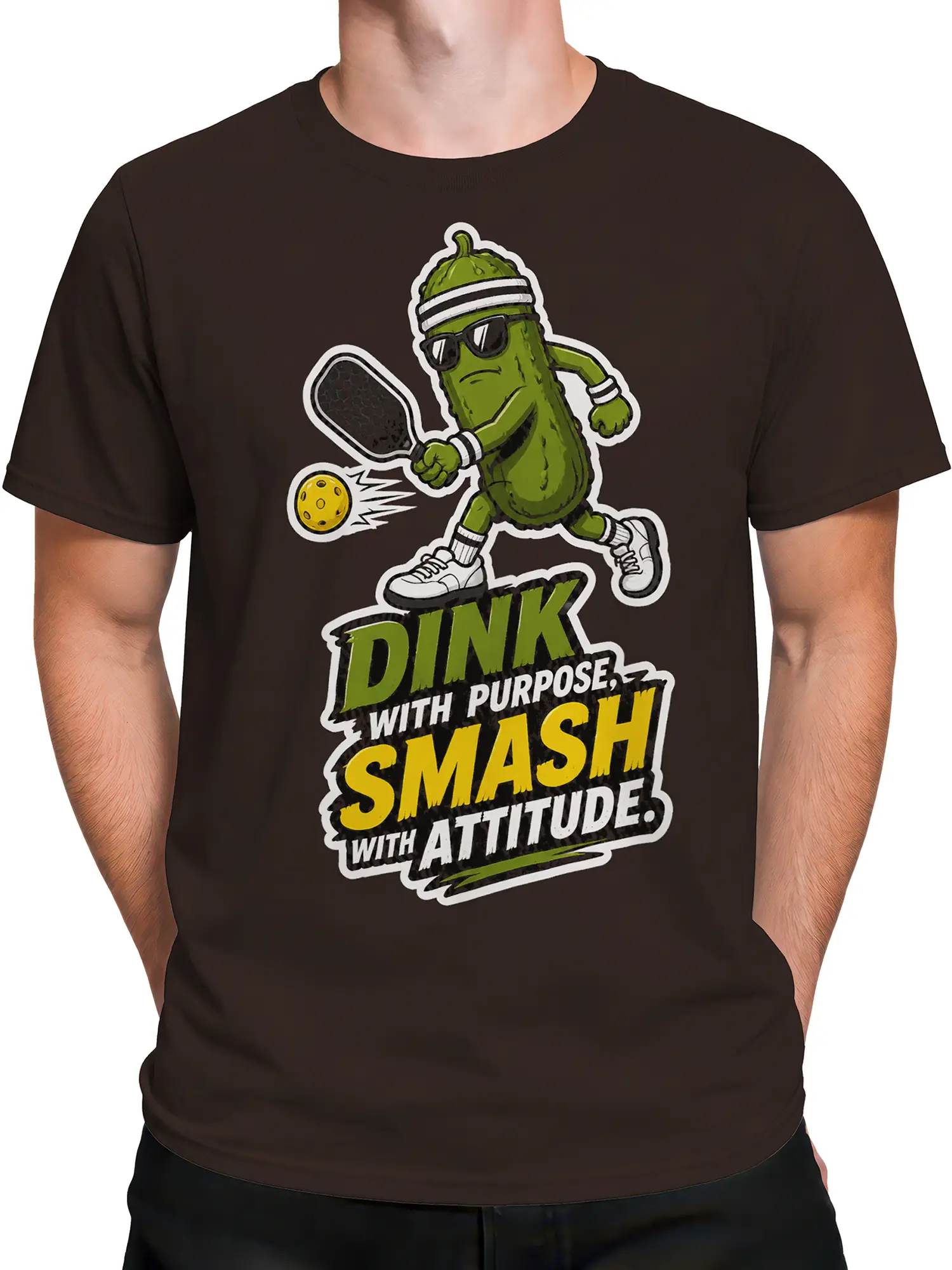 Male torso wearing a brown pickleball T-shirt with a green pickle athlete and paddle graphic