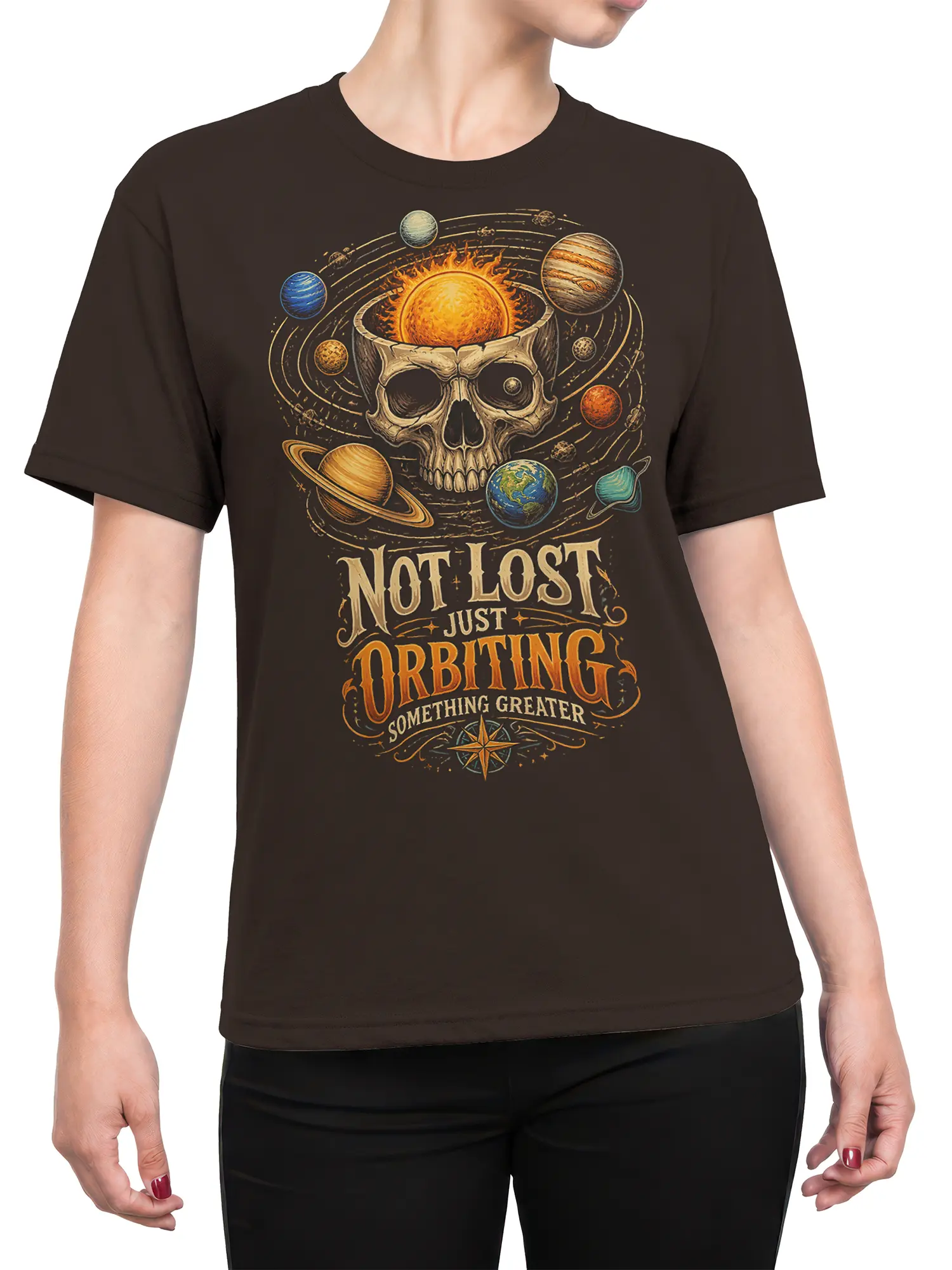 Female torso wearing a dark brown space T-shirt with a vintage skull and orbiting planets design