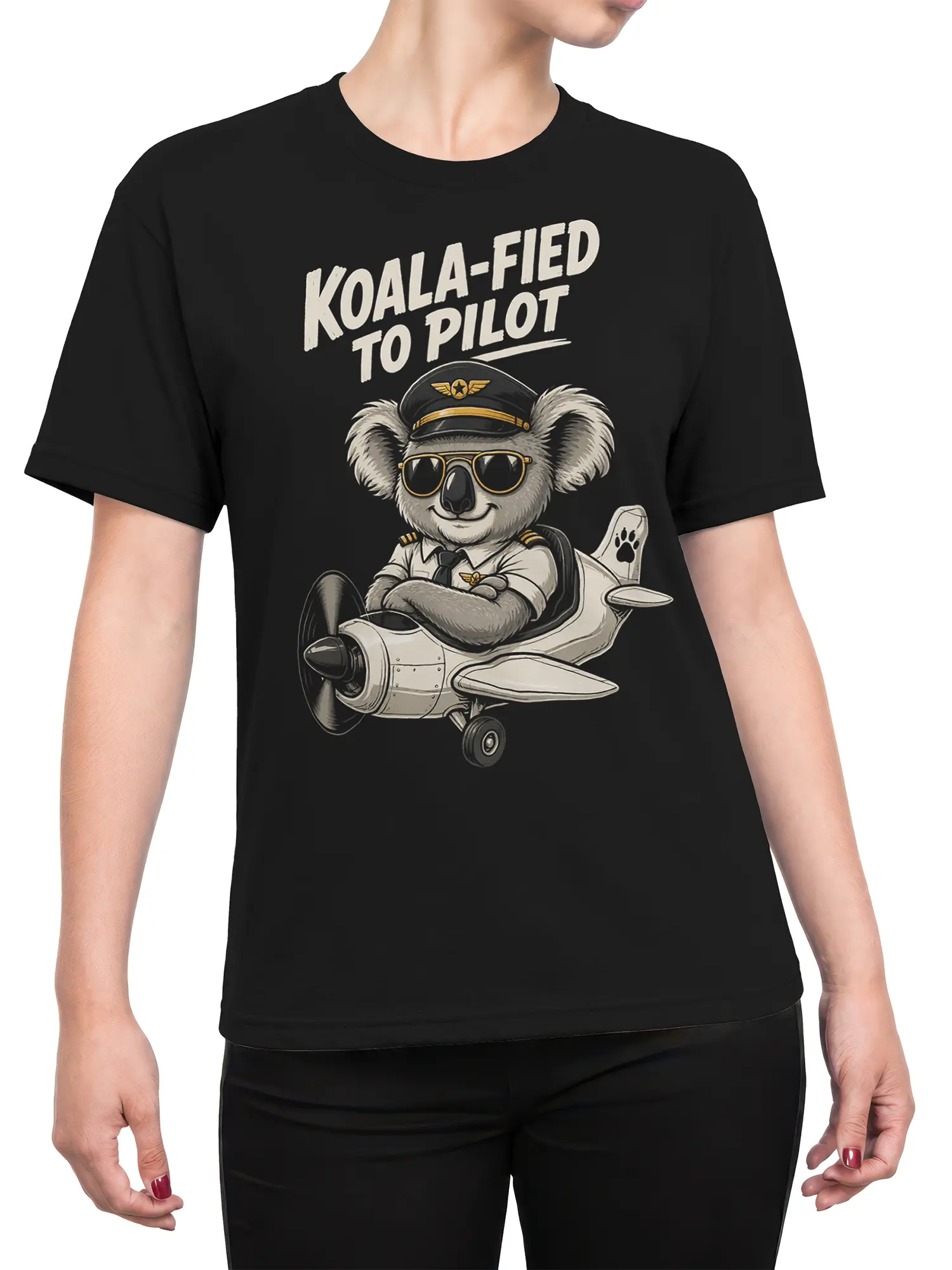 Female torso wearing a black koala pilot T-shirt with vintage airplane artwork and bold aviation-themed lettering