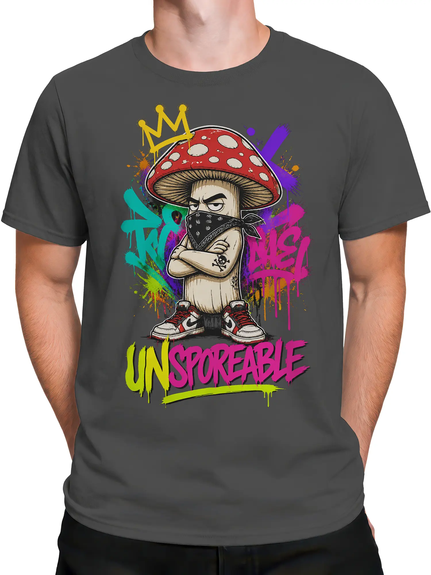 Male torso wearing a dark gray crowned mushroom T-shirt with graffiti artwork and bold UNSPOKEABLE text