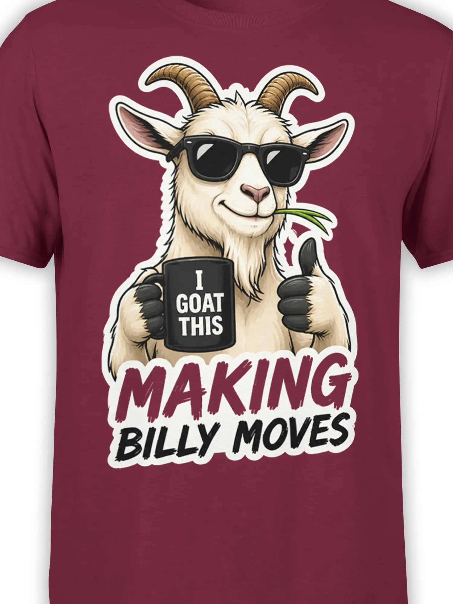 Close-up of the sunglasses-wearing goat, black mug, green grass, and bold lettering on the burgundy shirt