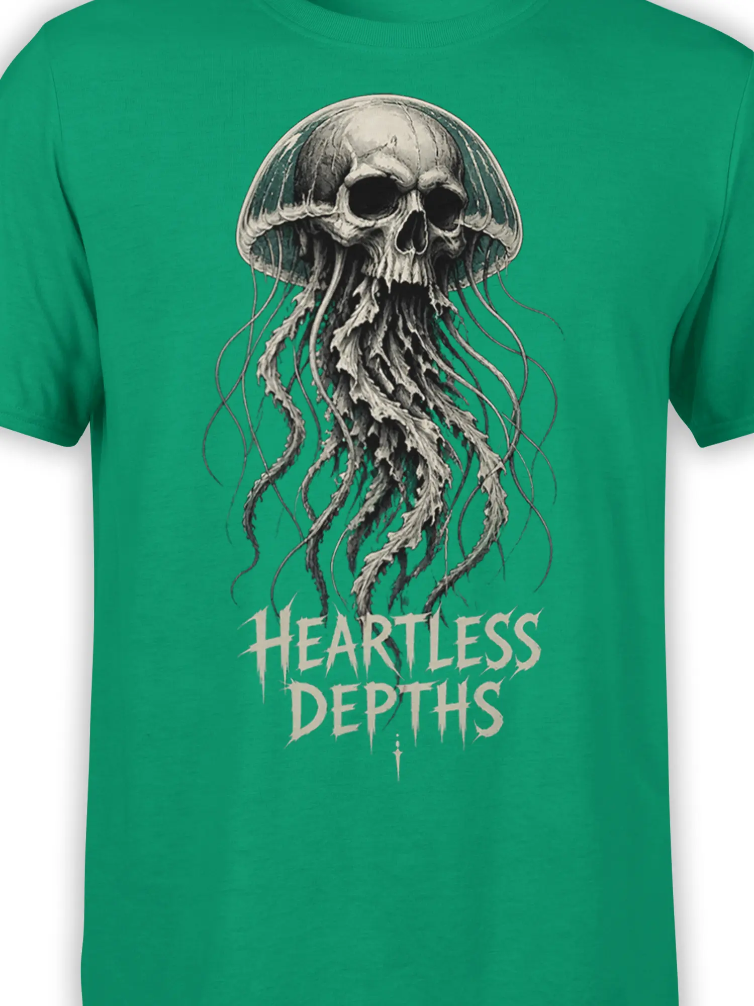 Close-up of a skull jellyfish graphic and Heartless Depths lettering on green fabric