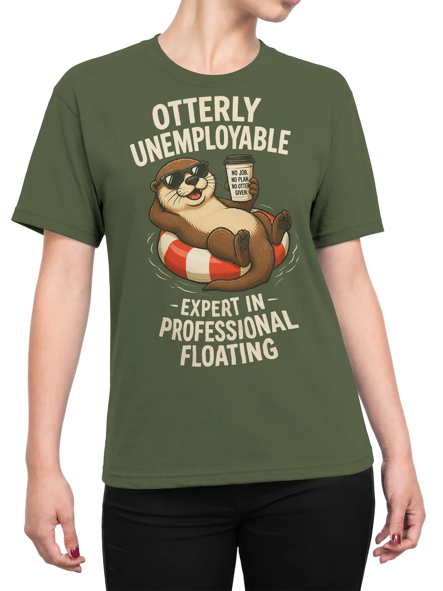Female torso wearing an olive green otter graphic T-shirt with sunglasses, coffee, and humorous floating-themed lettering