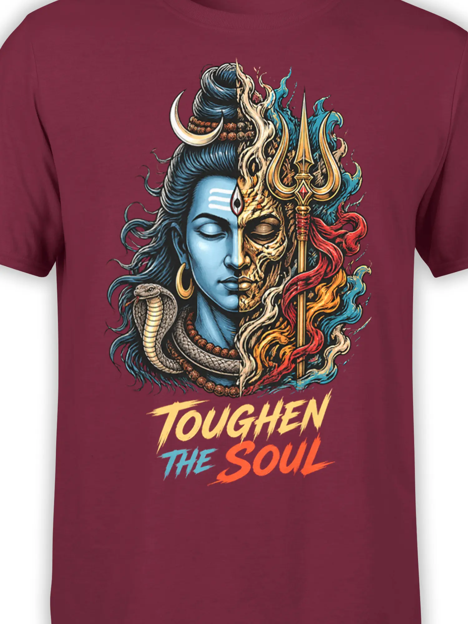 Close-up of the burgundy graphic tee showing the split serene and fierce face, trident, cobra, and Toughen the Soul text