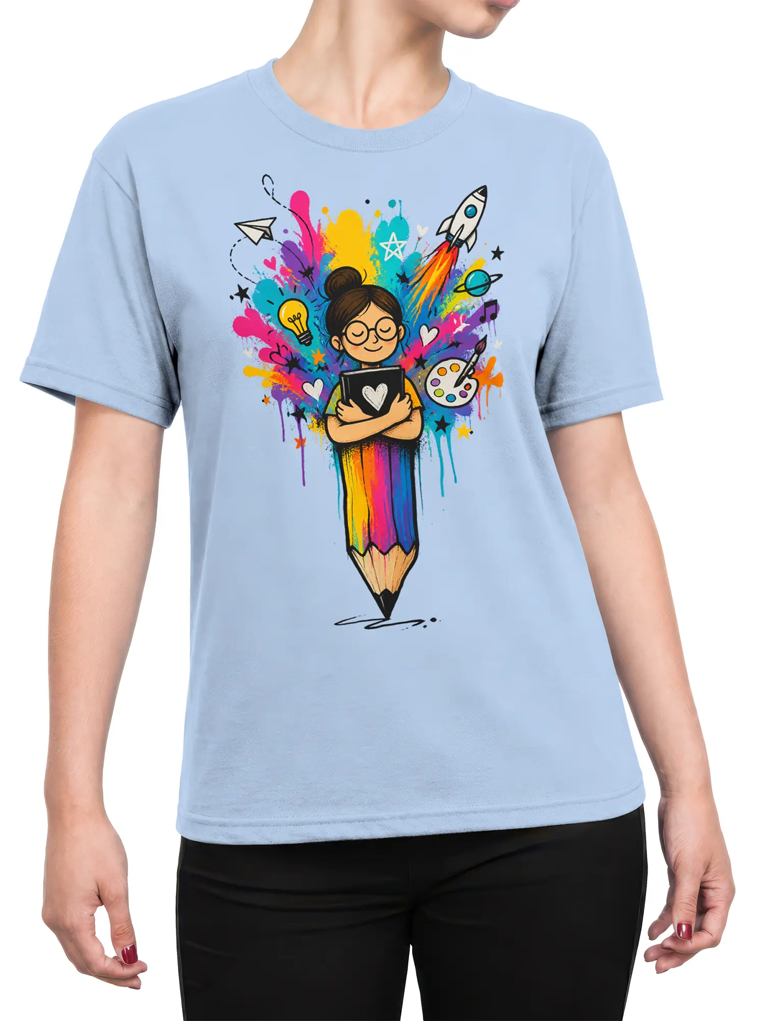 Female torso wearing a light blue artist T-shirt with a colorful creative girl and giant pencil design